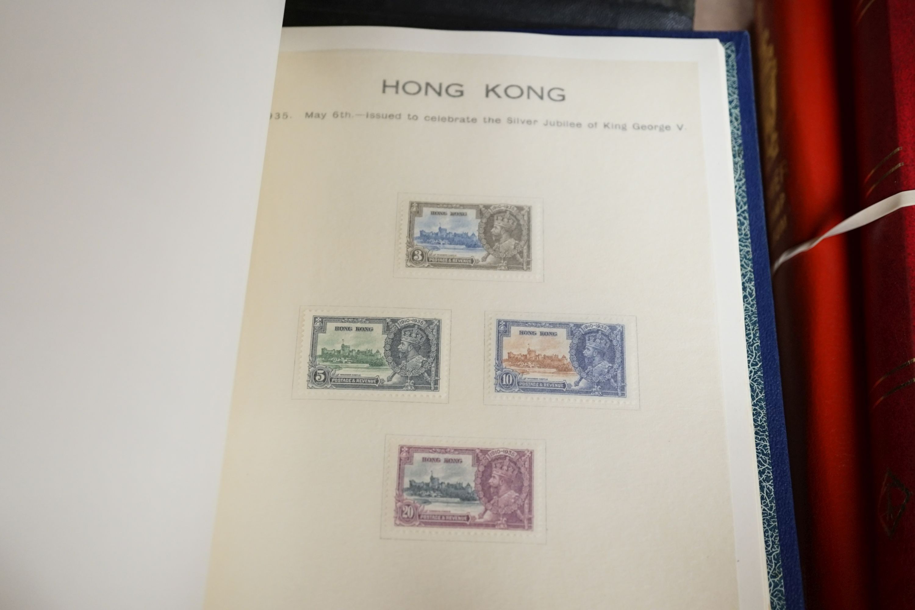 Three stamp albums with 1935 Silver Jubilee mint set of 250 including Egypt, 1937 Coronation two mint sets plus some used